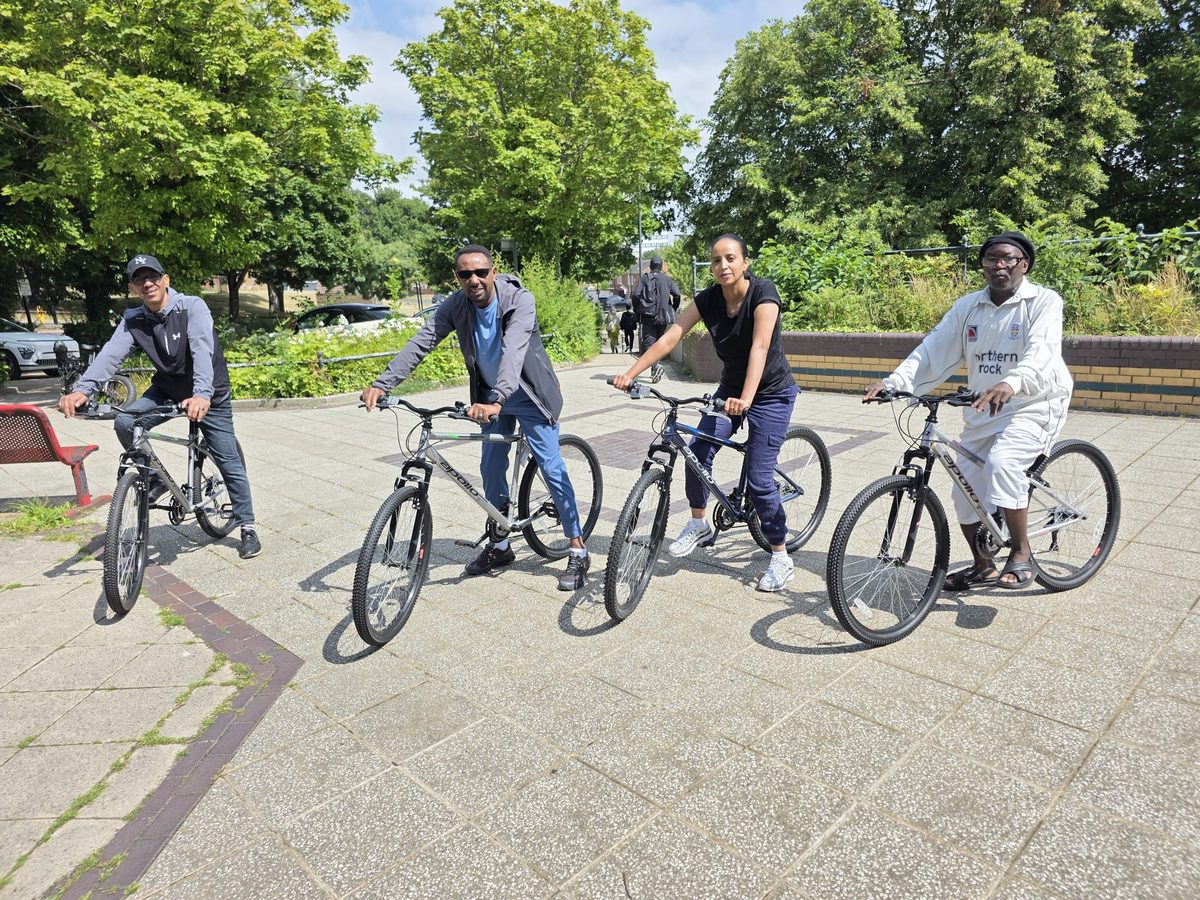 TWECA members on bikes at a community cycling session