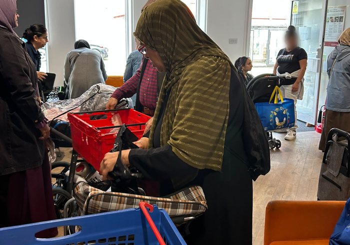 People collecting food at a community food support session
