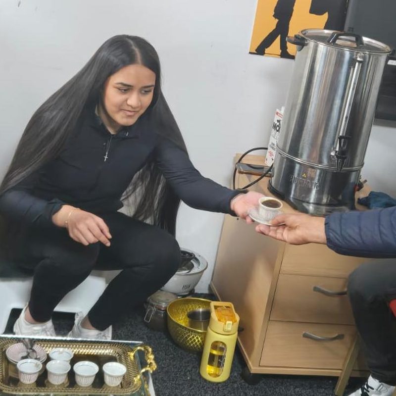 Community members sharing coffee together